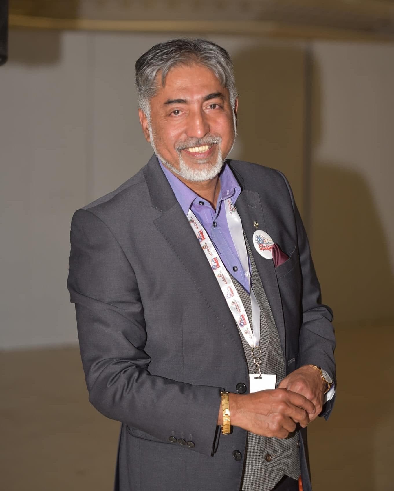 Mizanur Rahman Mizan in a grey suit