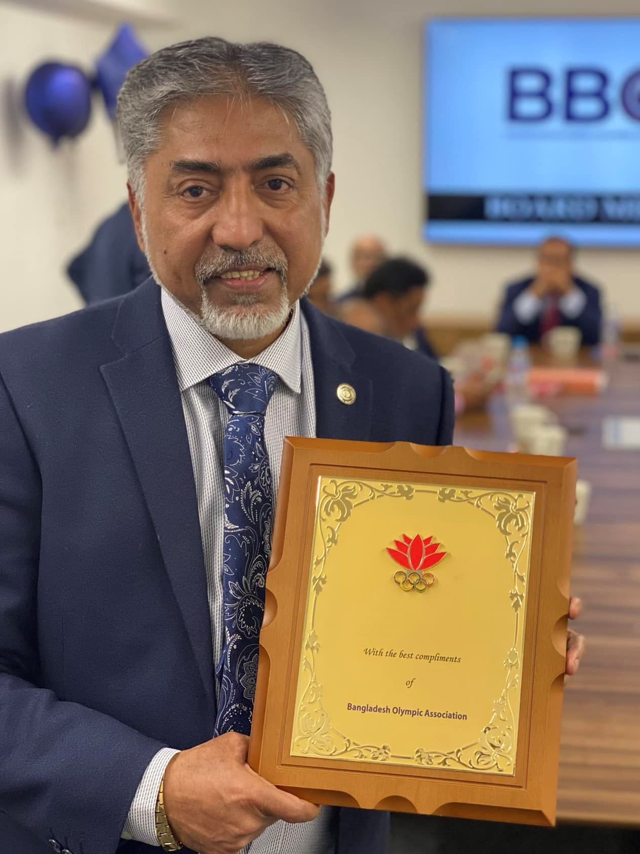 Receiving an award plaque