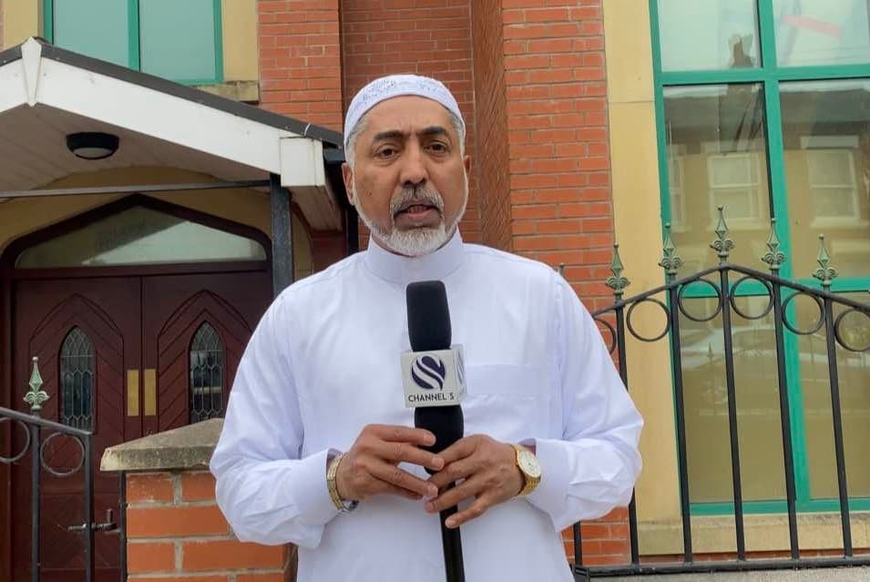Mizanur Rahman Mizan reporting with a Channel S microphone